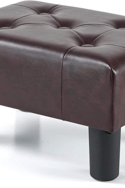 Small foot stool with legs, leather upholstered, stable construction for living room.