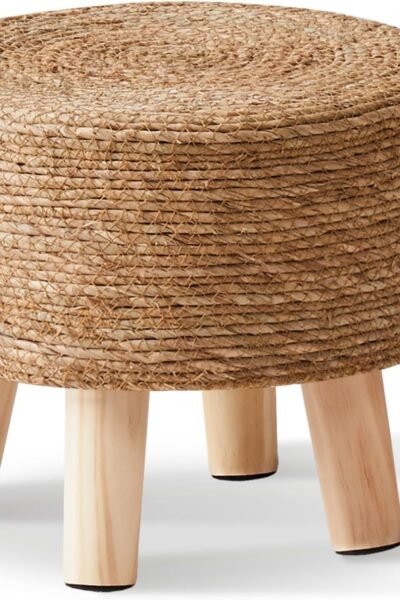 Natural seagrass hand-woven pouf ottoman, soft padded foot rest with non-skid pine legs, for hallway office lounge.